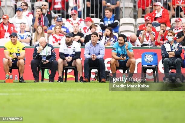 Bulldogs coach Trent Barrett and his staff watch on from the bench during the round nine NRL match between the St George Illawarra Dragons and the...