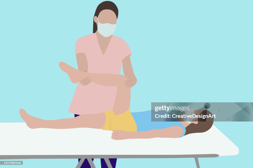 Physiotherapist Treating Her Patient In The Clinic