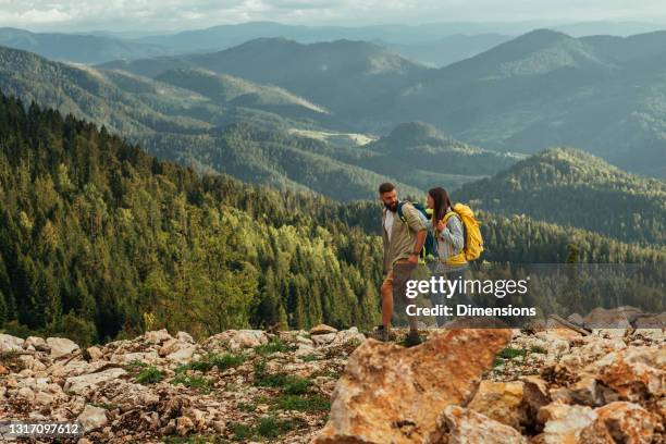 real freedom lies in wilderness not in civilization - young couple hiking stock pictures, royalty-free photos & images