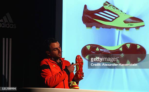 Philipp Schapitz, GTM Manager & BU Interactive, Sports Performance Divison of adidas AG explains the boot functions during the adidas adizero F50...