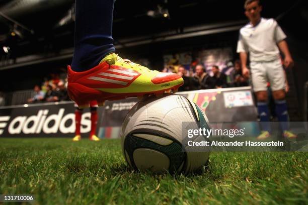 Young footballers play a demonstration match with the new adizero boots during the adidas adizero F50 miCoach launch event at Miller studio on...