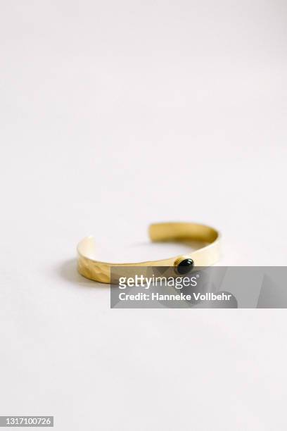 gold plated rustic bracelet with gemstone - bracelet ストックフォトと画像