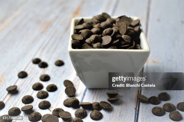 chocolate chips - chocolate chips stock pictures, royalty-free photos & images