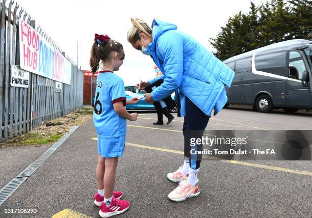 Steph Houghton of Manchester City signs a young fans shirt prior to the Barclays FA Women's Super League match between West Ham United Women and...