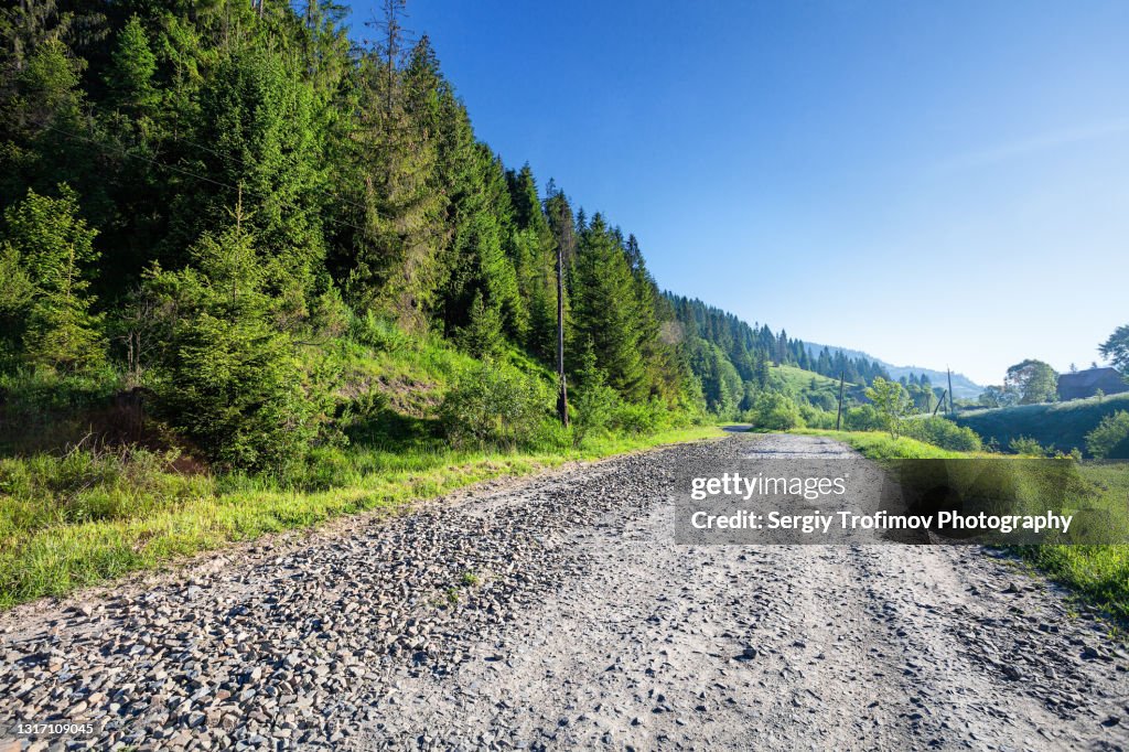 Country gravel road in mountain village