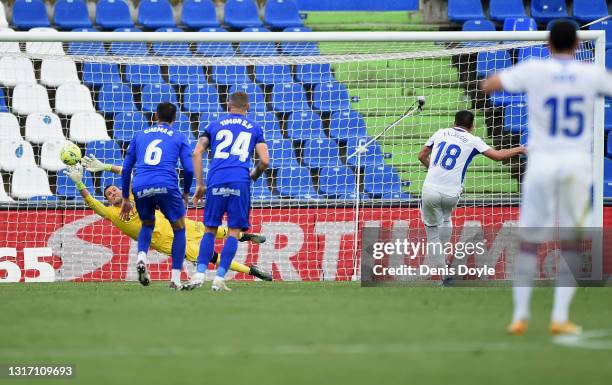 Recio of SD Eibar scores their team's first goal from the penalty spot past David Soria of Getafe CF during the La Liga Santander match between...