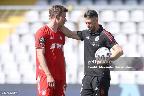 Martin Demichelis, coach of Bayern München reacts with his player and team captain Nicolas Feldhahn after the 3. Liga match between Bayern München II...