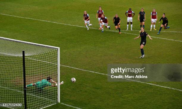 Mackenzie Arnold of West Ham United saves a penalty from Sam Mewis of Manchester City during the Barclays FA Women's Super League match between West...