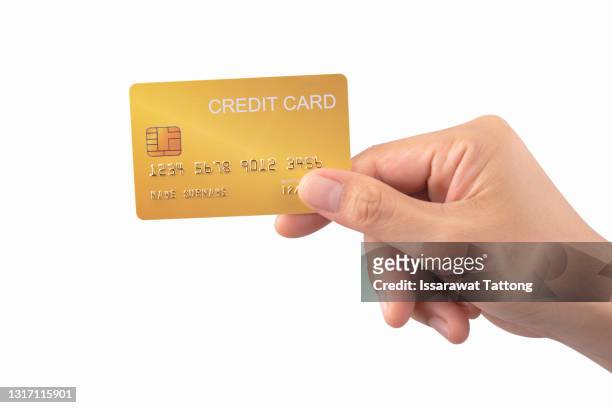 hand holding credit card isolated on white - credit card stock-fotos und bilder