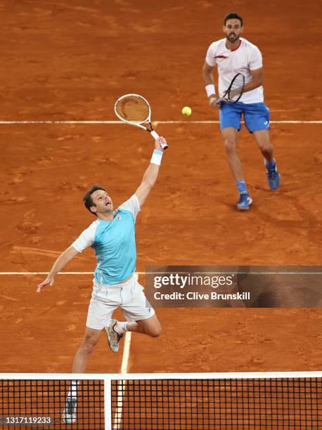Horacio Zeballos of Argentina plays a forehand shot as Marcel Granollers of Spain looks on during their Mens Doubles Final match against Nikola...