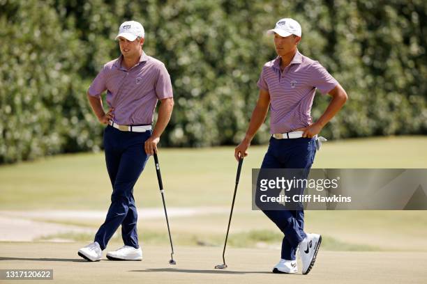 Pierceson Coody and John Pak of Team USA look on from the 14th green during Sunday foursomes matches on Day Two of The Walker Cup at Seminole Golf...