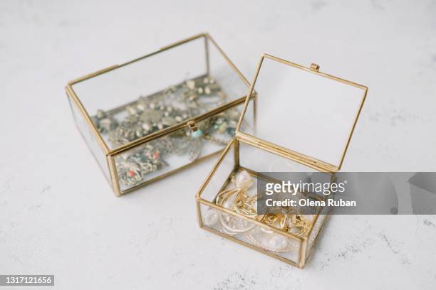 transparent jewelry boxes with gold ornaments - fine jewelry stock pictures, royalty-free photos & images