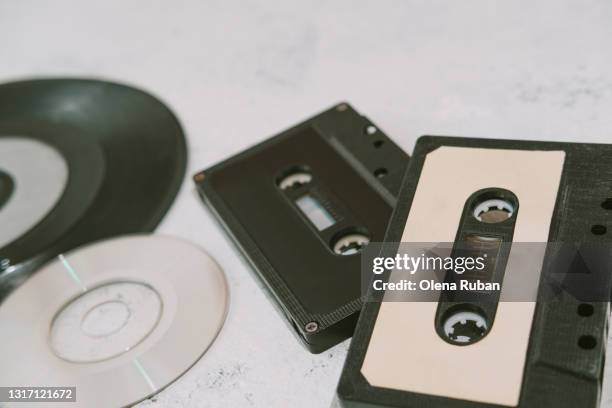 collection of musical disks, records and cassettes - film set stockfoto's en -beelden