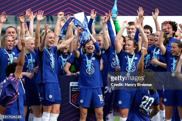 Ji So-Yun of Chelsea holds the Barclays FA Women's Super League Trophy as their team mates celebrate after the Barclays FA Women's Super League match...