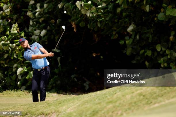 Matty Lamb of Team Great Britain and Ireland plays his shot on the 13th hole during Sunday foursomes matches on Day Two of The Walker Cup at Seminole...