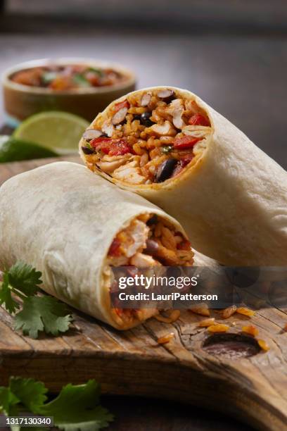 mexican rice and chicken burrito - wrapped burrito stock pictures, royalty-free photos & images