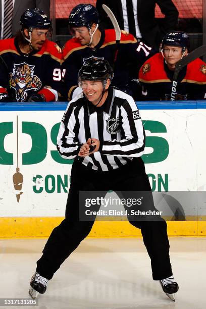 Linesmen Pierre Racicot keeps a watchful eye while the Florida Panthers host the Tampa Bay Lightning at the BB&T Center on May 8, 2021 in Sunrise,...