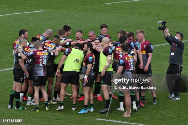 The Harlequins players form a huddle after the Gallagher Premiership Rugby match between Harlequins and Wasps at Twickenham Stoop on May 09, 2021 in...