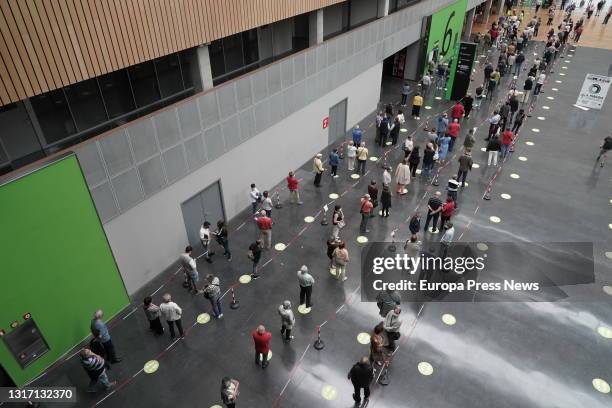 Several people queue to receive the Covid-19 vaccine at the Bilbao Exhibition Center in Barakaldo, on 9 May, 2021 in Barakaldo, Vizcaya, Euskadi,...