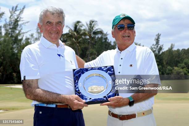 Martin Slumbers and Jimmy Dunne pose for photos during Sunday singles matches on Day Two of The Walker Cup at Seminole Golf Club on May 09, 2021 in...