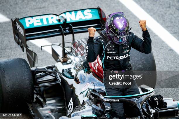 Race winner Lewis Hamilton of Great Britain and Mercedes GP celebrates in parc ferme during the F1 Grand Prix of Spain at Circuit de...