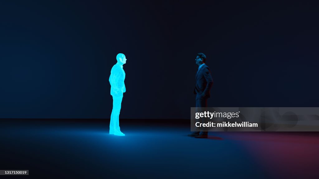 Hombre conoce avatar digital de sí mismo hecho con un holograma