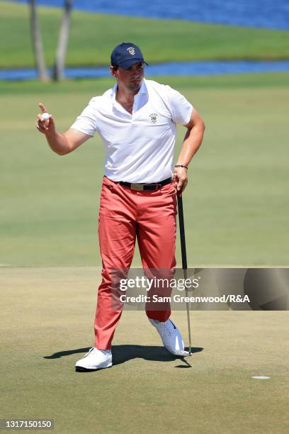 Quade Cummins of Team USA reacts on the second green during Sunday singles matches on Day Two of The Walker Cup at Seminole Golf Club on May 09, 2021...