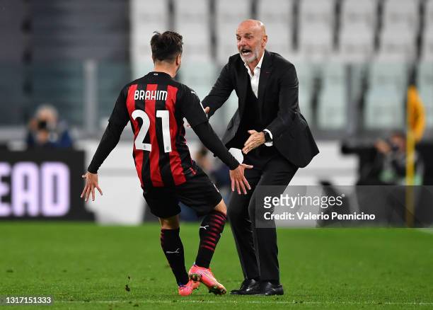 Brahim Diaz of A.C. Milan celebrates with Stefano Pioli after scoring their side's first goal during the Serie A match between Juventus and AC Milan...
