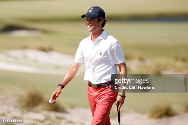 Cole Hammer of Team USA reacts on the second green during Sunday singles matches on Day Two of The Walker Cup at Seminole Golf Club on May 09, 2021...