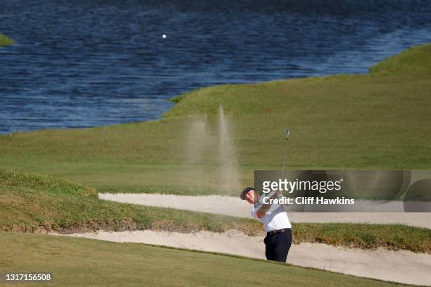 Ben Jones of Team Great Britain and Ireland plays his shot from the bunker on the second hole during Sunday singles matches on Day Two of The Walker...