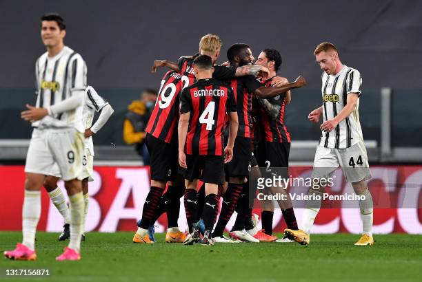 Ante Rebic of A.C. Milan celebrates with team mates after scoring their side's second goal during the Serie A match between Juventus and AC Milan at...