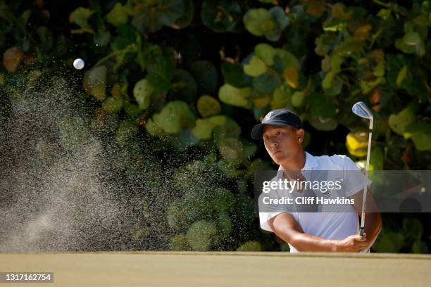 John Pak of Team USA plays his shot from the bunker on the 13th hole during Sunday singles matches on Day Two of The Walker Cup at Seminole Golf Club...