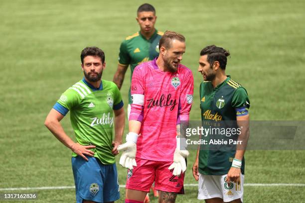 Joao Paulo, Stefan Frei of Seattle Sounders and Diego Valeri of Portland Timbers have a conversation in the second half at Providence Park on May 09,...