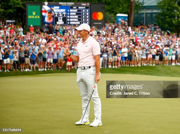 Rory McIlroy of Northern Ireland celebrates winning on the 18th green during the final round of the 2021 Wells Fargo Championship at Quail Hollow...