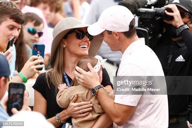 Rory McIlroy of Northern Ireland celebrates with his wife Erica and daughter Poppy after winning during the final round of the 2021 Wells Fargo...