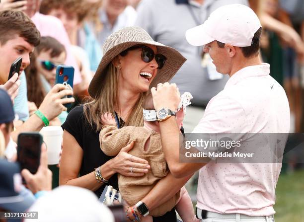 Rory McIlroy of Northern Ireland celebrates with his wife Erica and daughter Poppy after winning during the final round of the 2021 Wells Fargo...