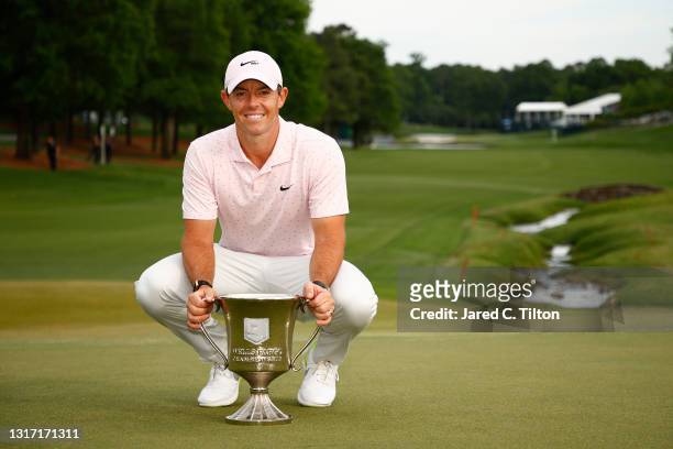 Rory McIlroy of Northern Ireland celebrates with the trophy after winning during the final round of the 2021 Wells Fargo Championship at Quail Hollow...