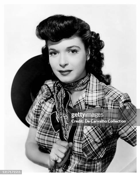 Actress Donna Martell dressed in a cowgirl outfit, as 'Angelita Diego', in a publicity shot from the short film/movie 'Ready to Ride' United States.