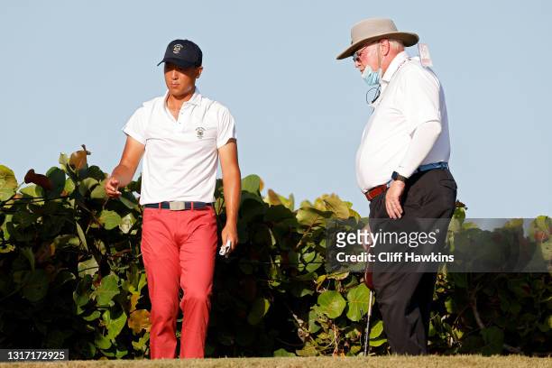 John Pak of Team USA speaks with a rules official on the 18th hole during Sunday singles matches on Day Two of The Walker Cup at Seminole Golf Club...