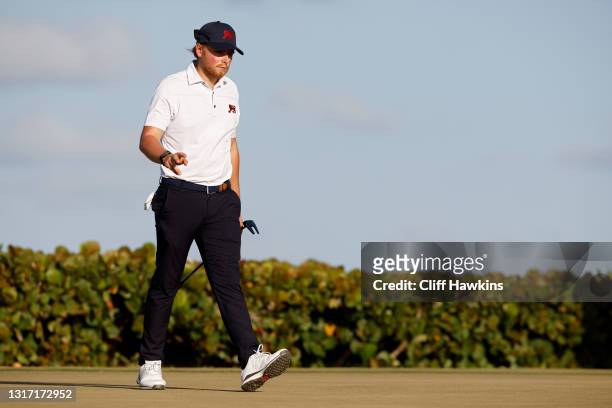 Joe Long of Team Great Britain and Ireland reacts on the 18th green during Sunday singles matches on Day Two of The Walker Cup at Seminole Golf Club...