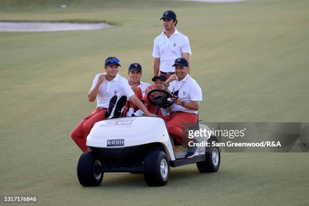 Members of Team USA ride a golf cart during Sunday singles matches on Day Two of The Walker Cup at Seminole Golf Club on May 09, 2021 in Juno Beach,...