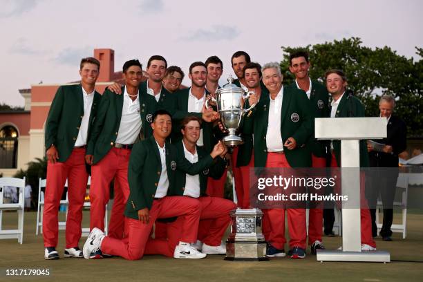 Team USA poses with the trophy after defeating Team Great Britain and Ireland on Day Two of The Walker Cup at Seminole Golf Club on May 09, 2021 in...