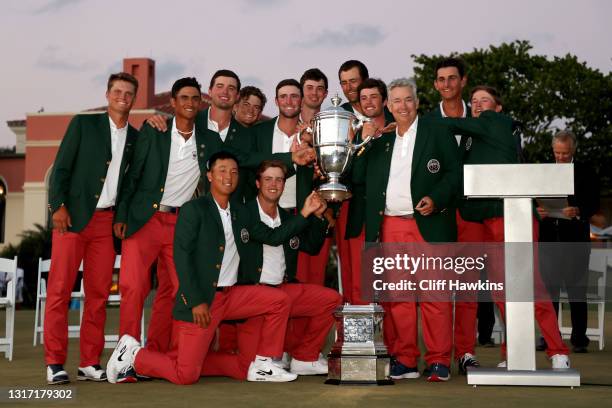 Team USA poses with the trophy after defeating Team Great Britain and Ireland on Day Two of The Walker Cup at Seminole Golf Club on May 09, 2021 in...