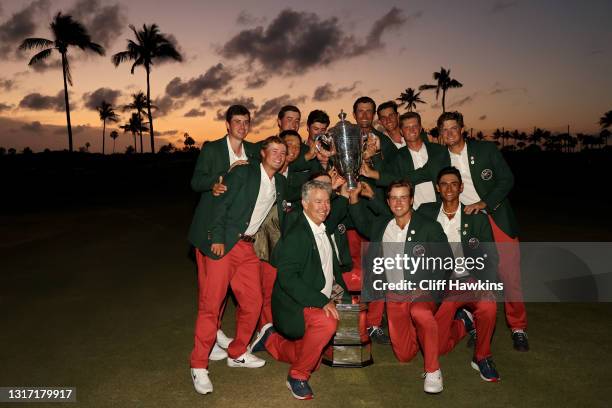 Team USA poses with the trophy after defeating Team Great Britain and Ireland 14-12 on Day Two of The Walker Cup at Seminole Golf Club on May 09,...