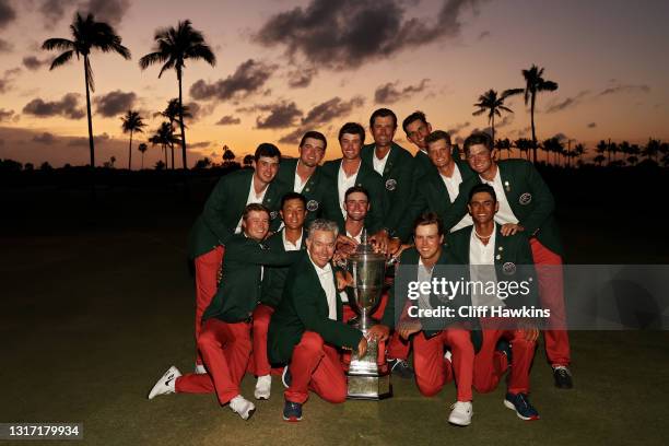 Team USA poses with the trophy after defeating Team Great Britain and Ireland 14-12 on Day Two of The Walker Cup at Seminole Golf Club on May 09,...