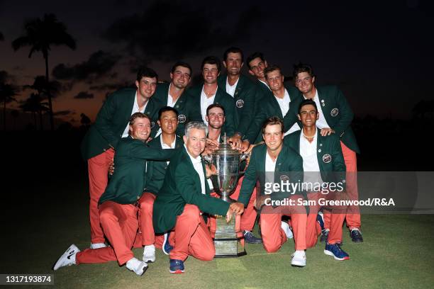 Team USA poses with the trophy after defeating Team Great Britain and Ireland 14-12 on Day Two of The Walker Cup at Seminole Golf Club on May 09,...