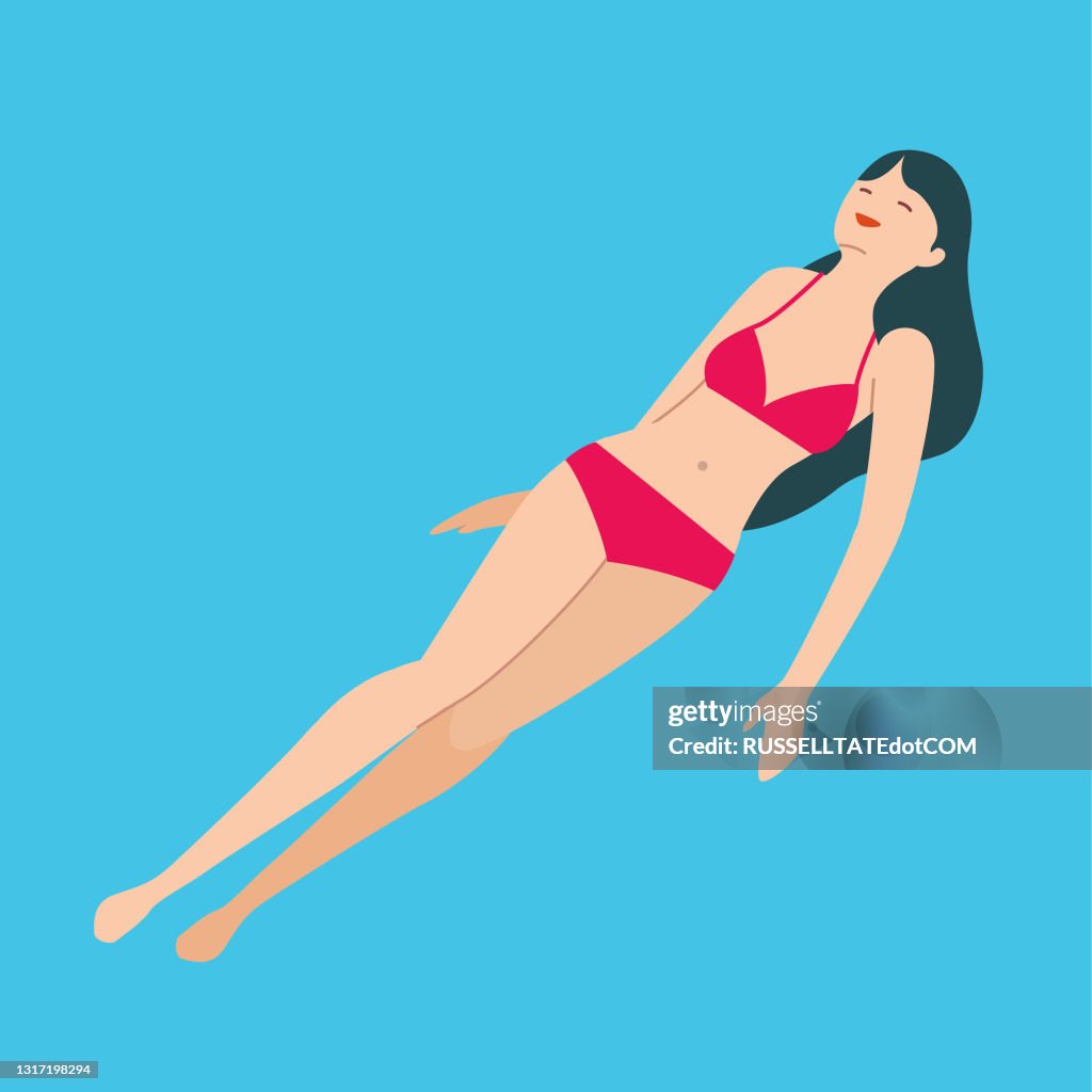 Swim suit girl afloat blue water