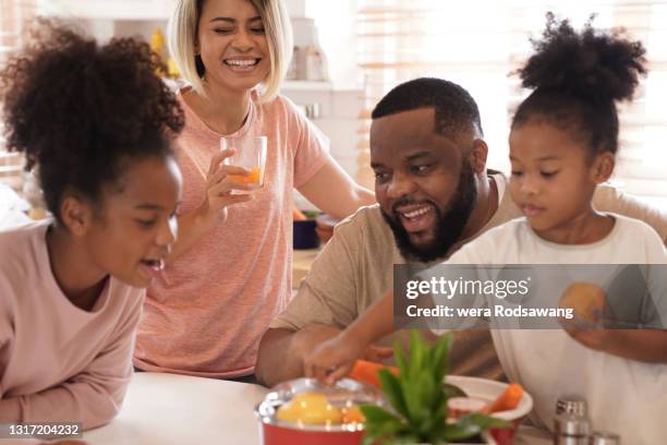 happy family time during breakfast together - young family in kitchen stock pictures, royalty-free photos & images