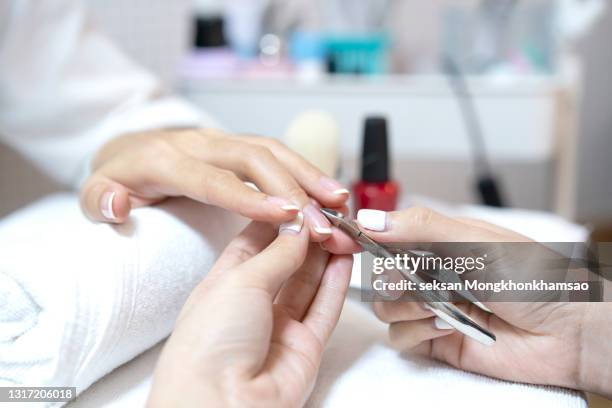 beauty manicure procedure - nail clippers stock pictures, royalty-free photos & images