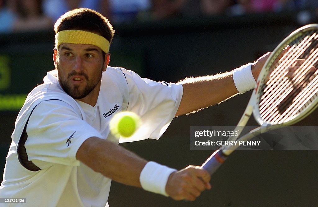 Australian Patrick Rafter plays a backha